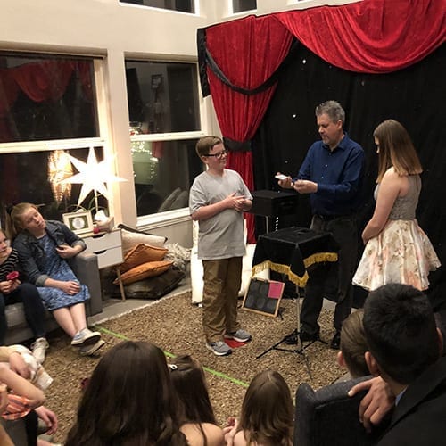 Teens enjoy Denver kids magician Chad Wonder's magic show